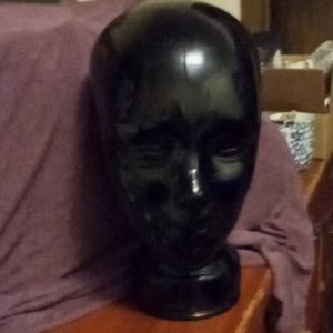 A glass wig head to keep your favorite styles on